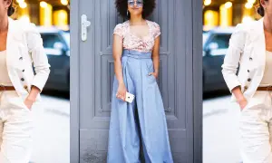 Donna con afro e occhiali da sole indossa un crop top floreale e un **pantalaccio** azzurro a vita alta.