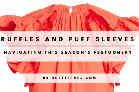 A bright orange top with voluminous ruffles and puff sleeves, overlaid with text.