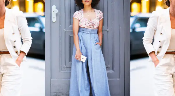 Donna con afro e occhiali da sole indossa un crop top floreale e un **pantalaccio** azzurro a vita alta.