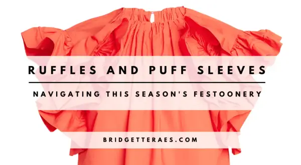 A bright orange top with voluminous ruffles and puff sleeves, overlaid with text.