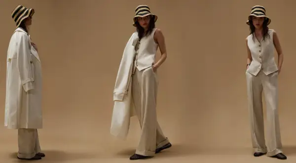 Modelli mostrano come indossare gilet donna con pantaloni ampi e trench leggero, completando il look con cappello a righe.