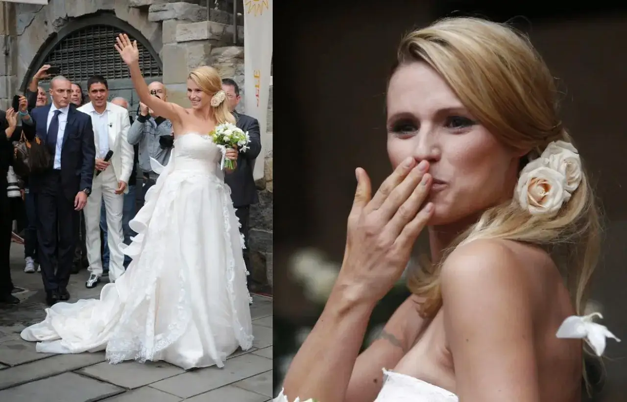 Michelle Hunziker nel suo abito da sposa, un sogno di pizzo e tulle, saluta i fan. Ricordi del matrimonio con Eros Ramazzotti.