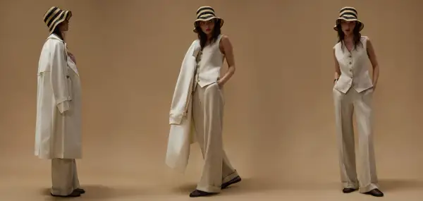 Modelli mostrano come indossare gilet donna con pantaloni ampi e trench leggero, completando il look con cappello a righe.